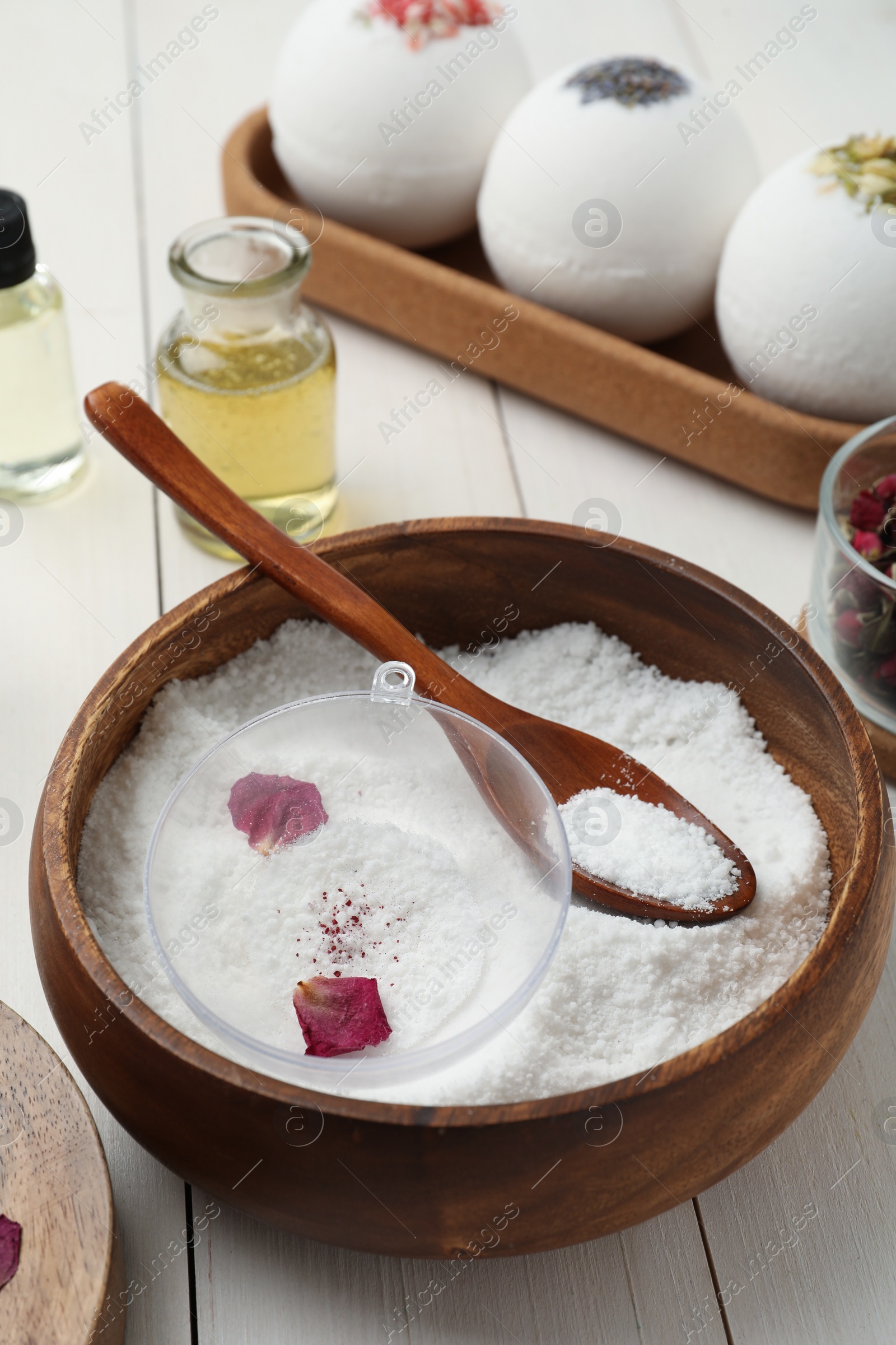 Photo of Composition with bath bomb ingredients on white wooden table