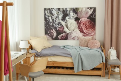 Photo of Stylish teenager's room interior with comfortable bed
