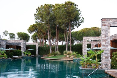 Swimming pool and tropical plants at luxury resort