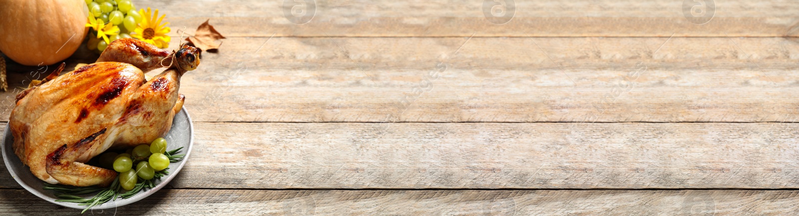 Image of Delicious turkey served on wooden table, space for text. Banner design