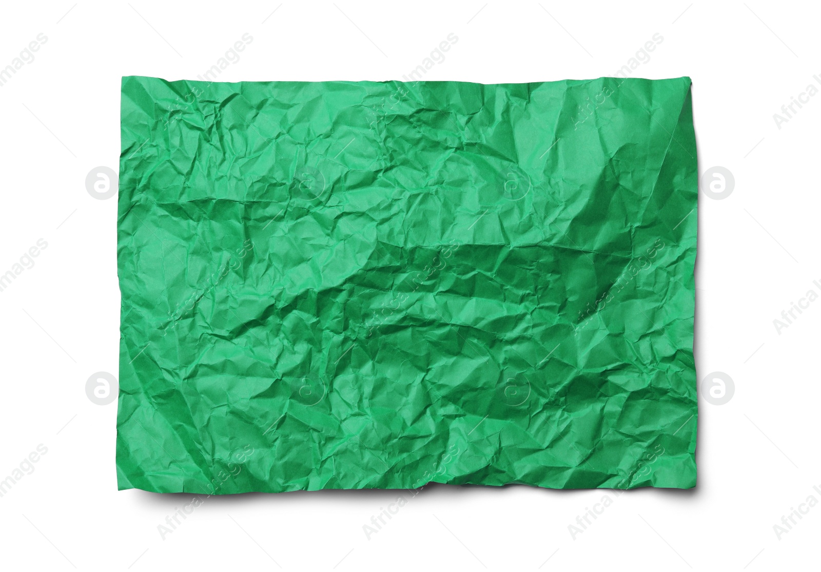 Photo of Color sheet of crumpled paper on white background, top view