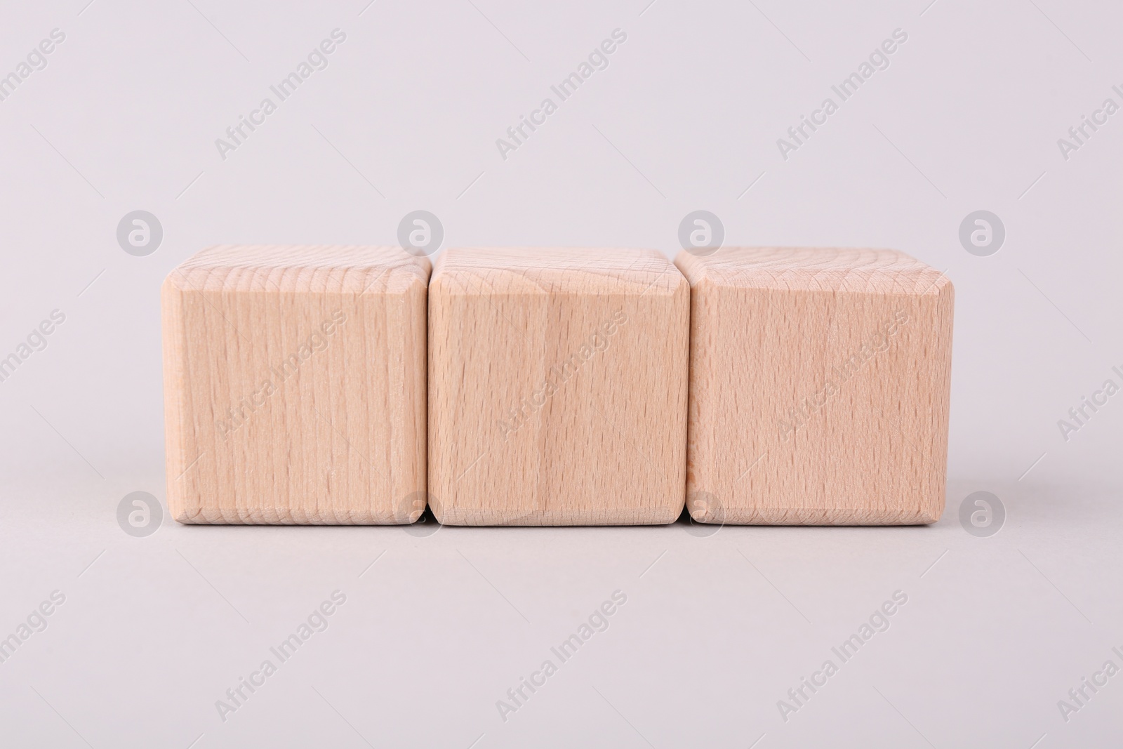 Photo of International Organization for Standardization. Cubes with abbreviation ISO on light grey background, closeup