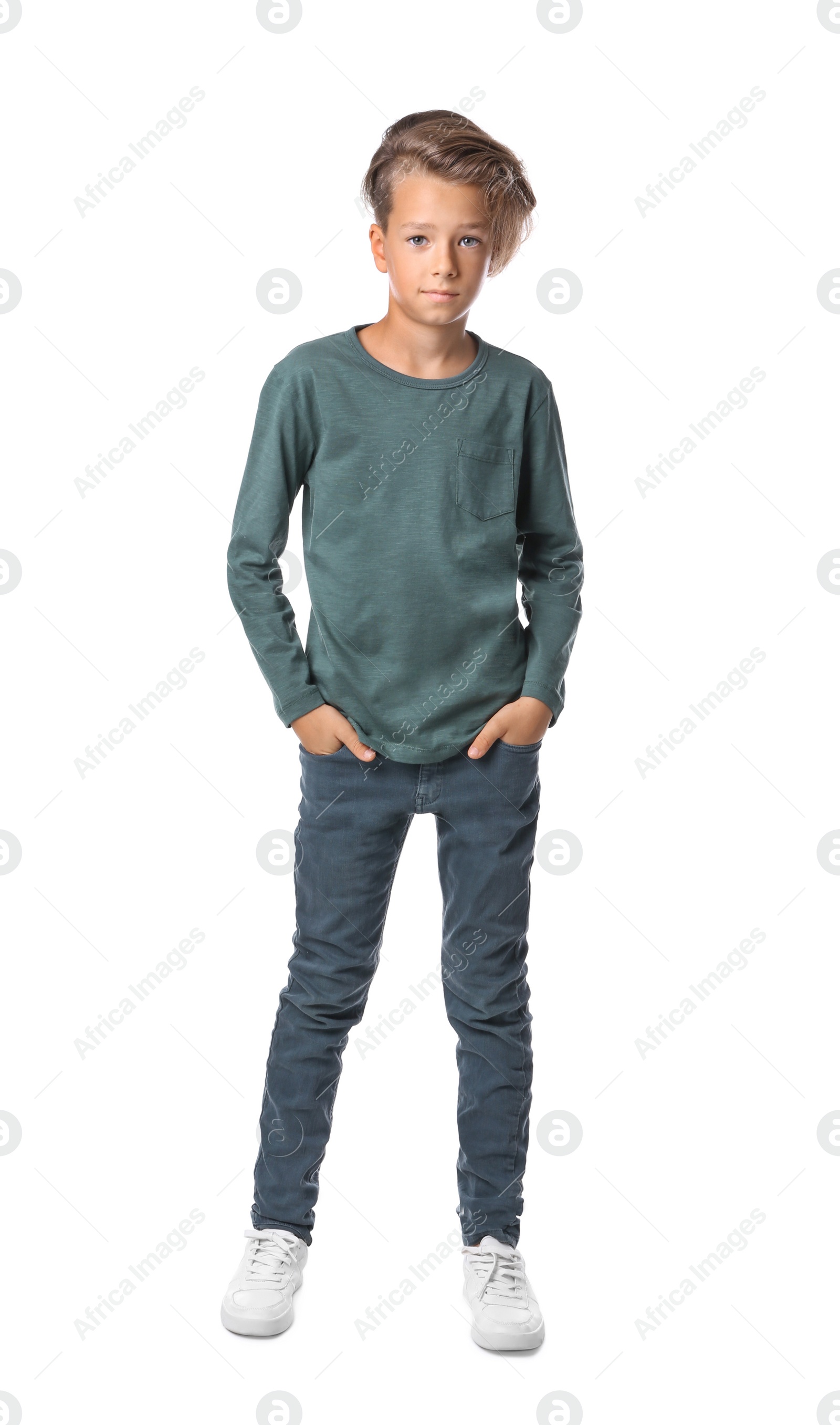 Photo of Portrait of cute little boy in casual outfit on white background