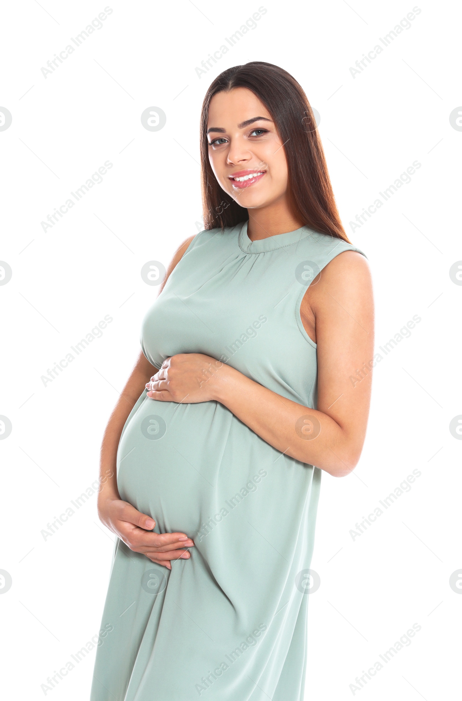 Photo of Portrait of beautiful young pregnant woman in dress on white background