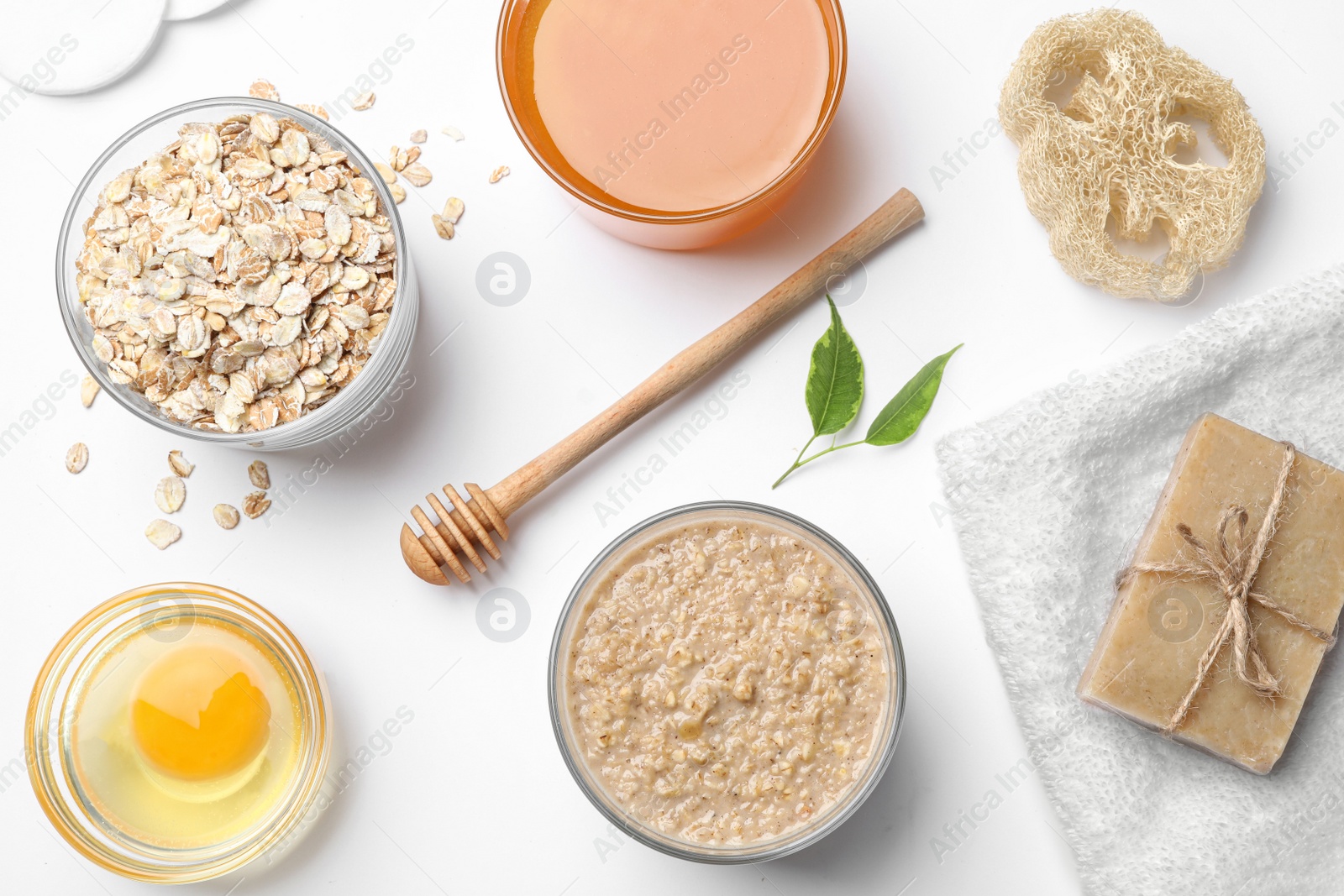 Photo of Composition of handmade face mask and ingredients on white background, top view