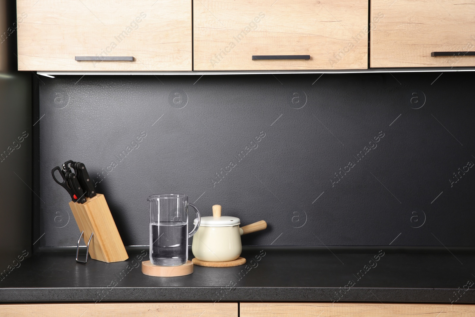 Photo of Composition with kitchenware on countertop. Space for text