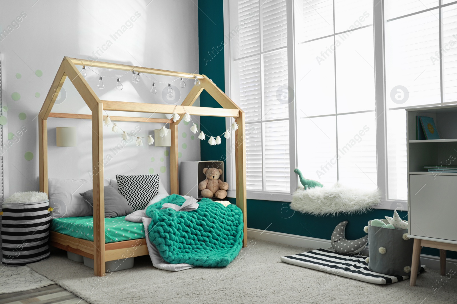 Photo of Cozy child room interior with comfortable bed