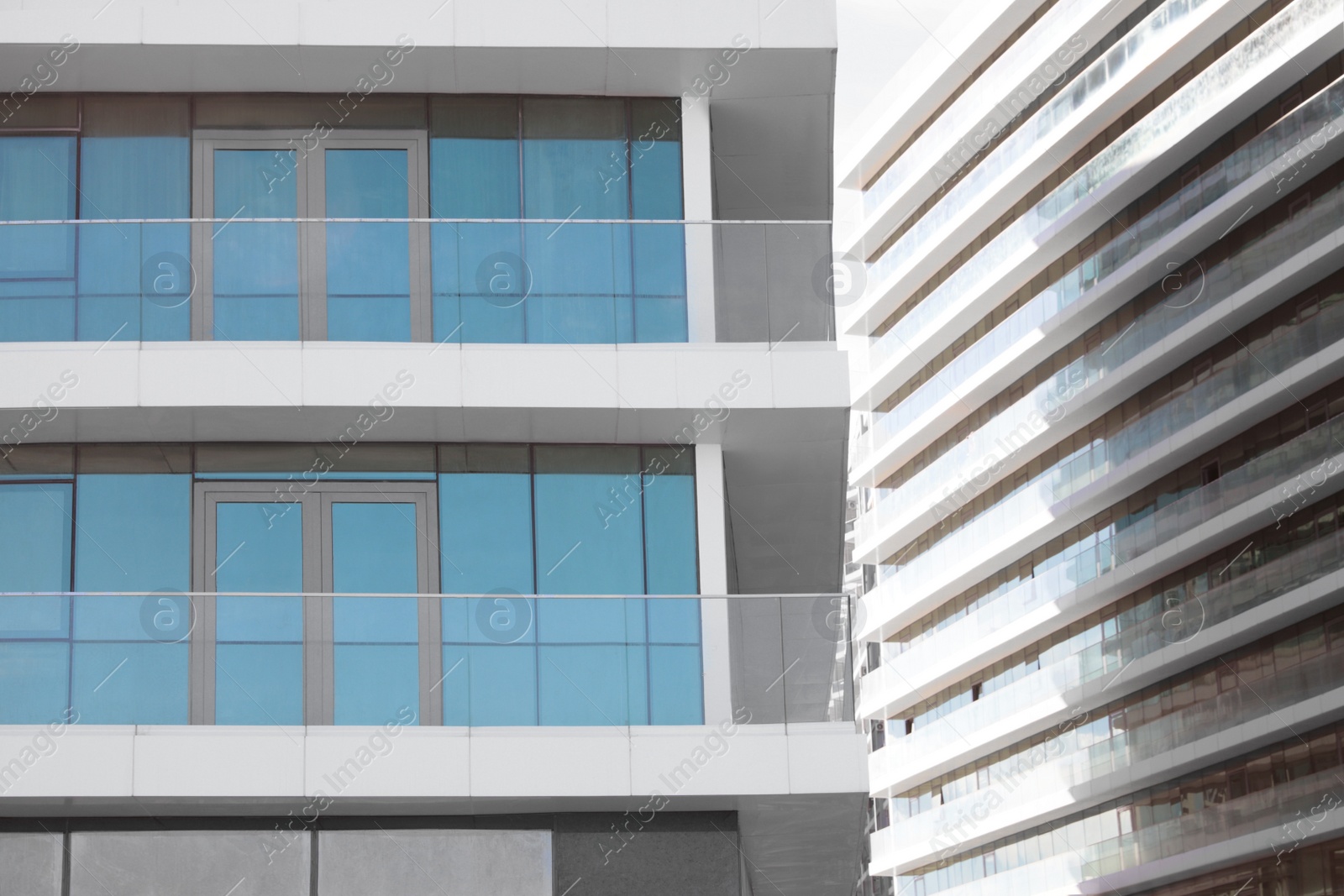 Photo of Exterior of residential building with balconies on sunny day