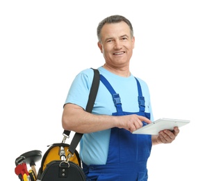 Photo of Mature plumber with tablet computer and tool bag on white background