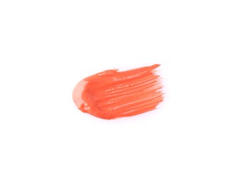 Photo of Stroke of coral lip gloss isolated on white, top view