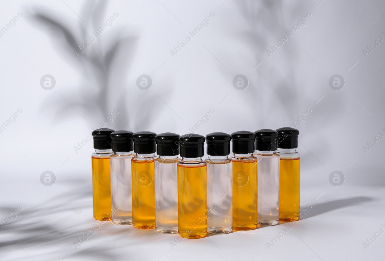 Photo of Many bottles of cosmetic products on white background