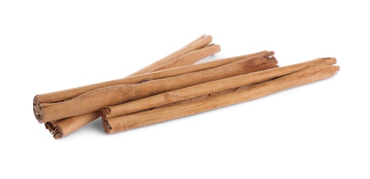 Aromatic brown cinnamon sticks on white background