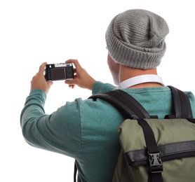 Photo of Man with backpack taking picture on white background, back view. Autumn travel