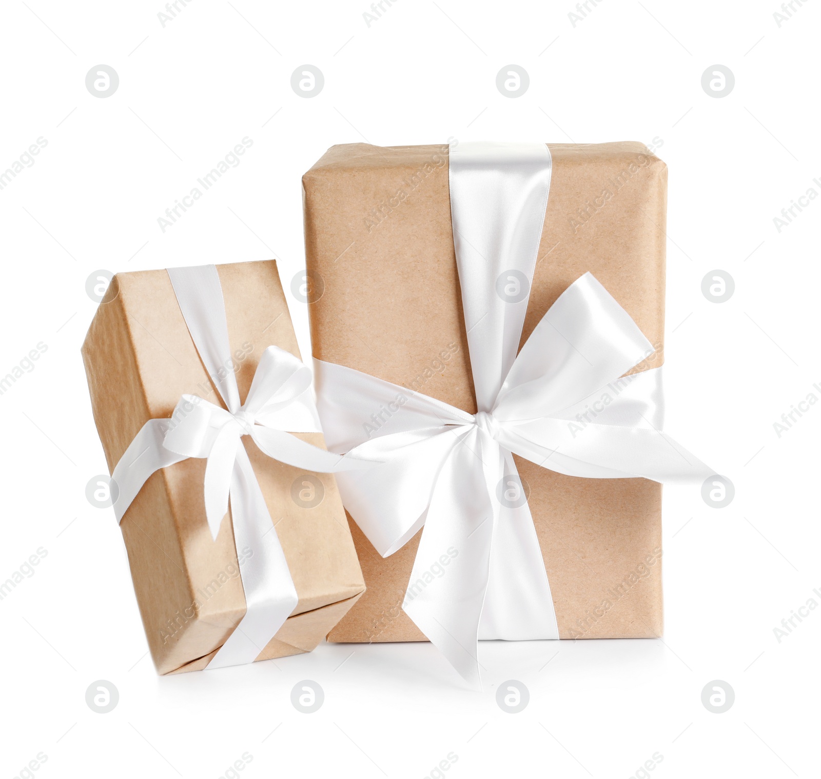 Photo of Beautifully wrapped gift boxes on white background