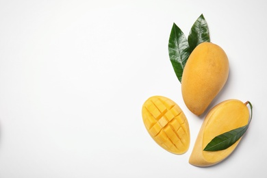 Photo of Composition with fresh mango fruits on white background, top view. Space for text