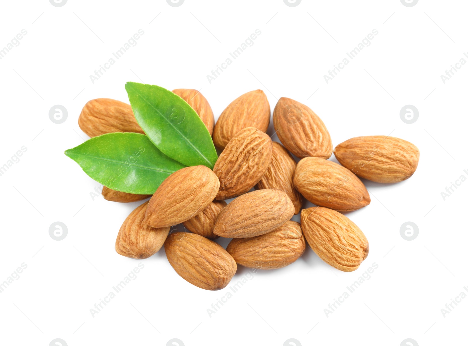 Photo of Organic almond nuts and green leaves on white background. Healthy snack