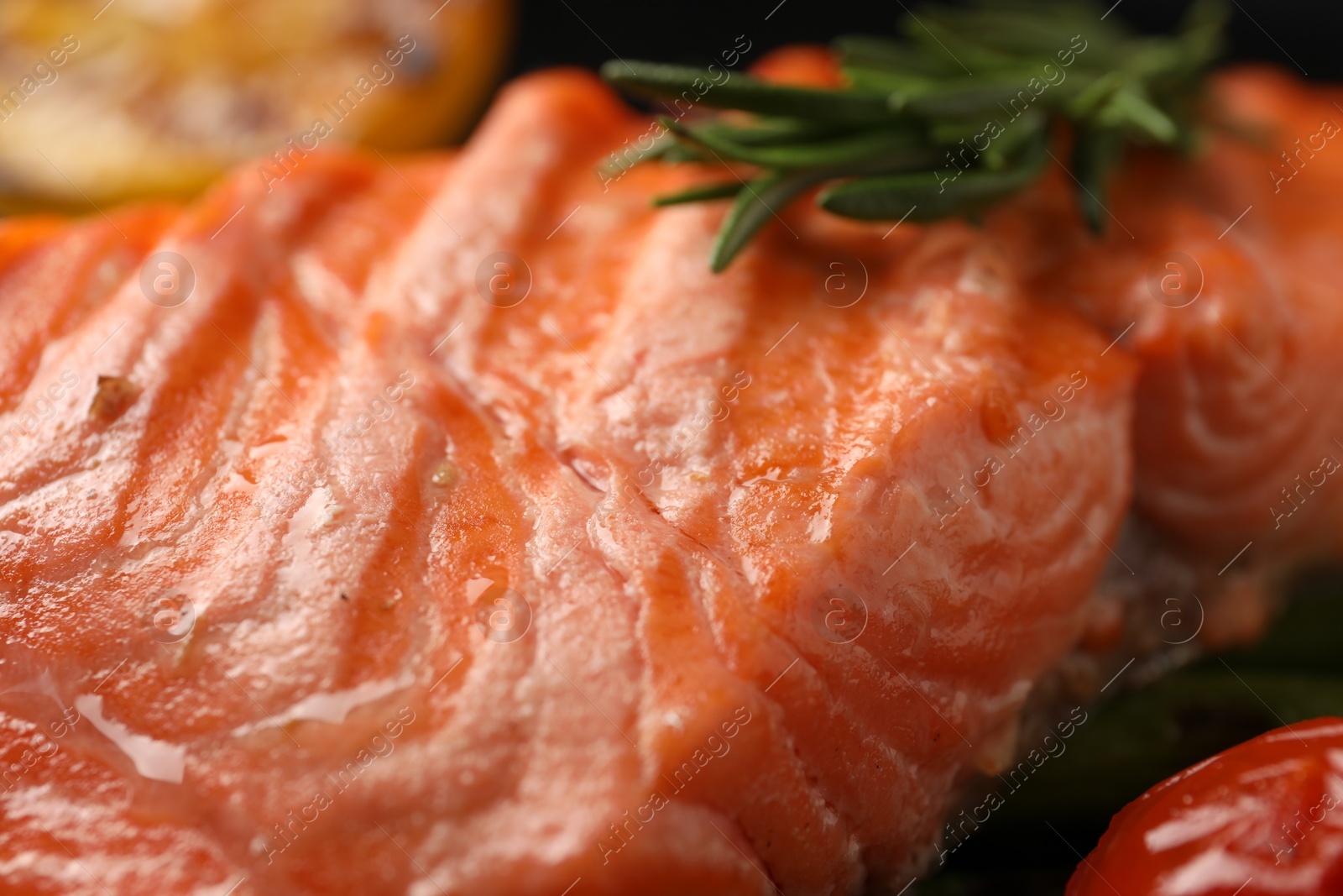 Photo of Tasty grilled salmon with rosemary, closeup view
