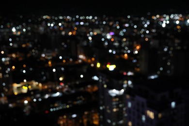 Blurred view of cityscape at night. Bokeh effect