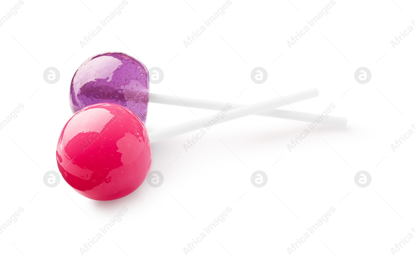 Photo of Two sweet colorful lollipops isolated on white