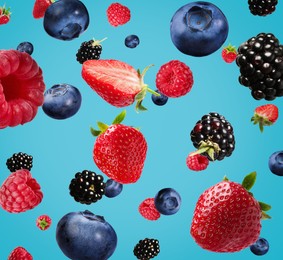 Image of Many different fresh berries falling on background