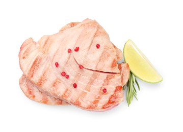 Photo of Delicious tuna steaks with spices, lime and rosemary isolated on white, top view