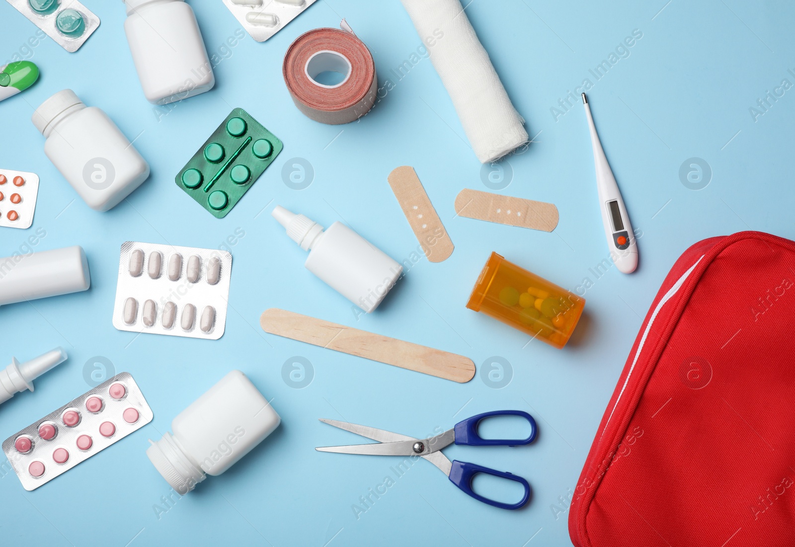 Photo of Flat lay composition with first aid kit on color background