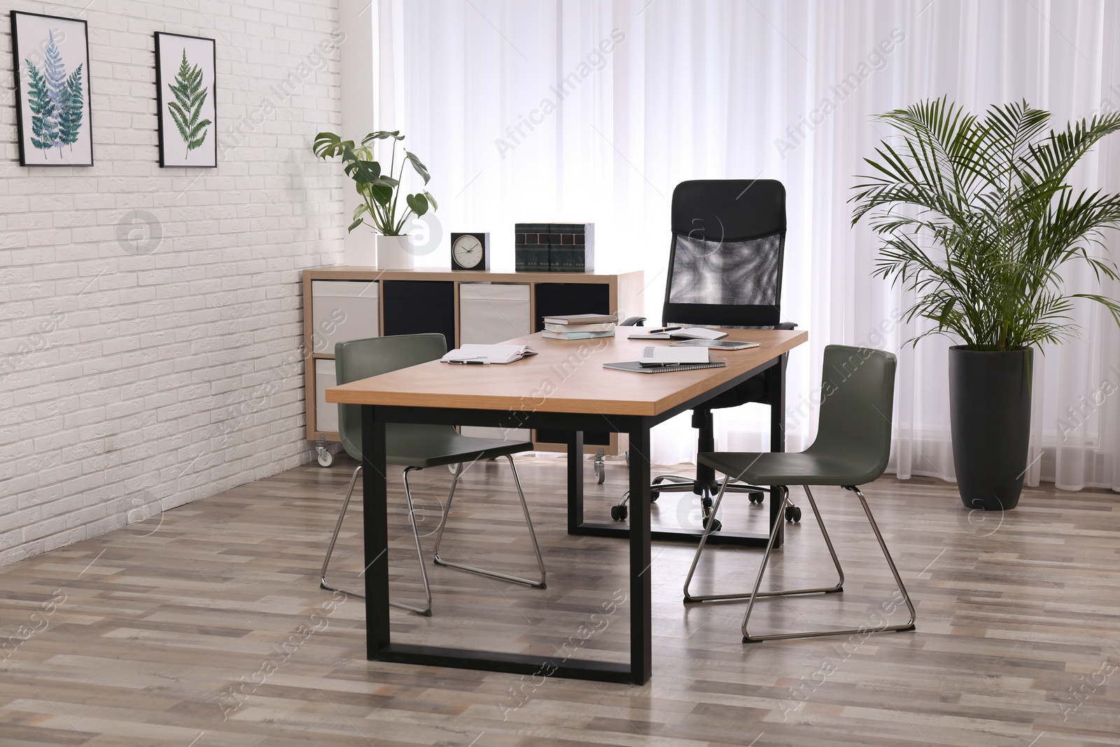 Photo of Director's office with large wooden table. Interior design