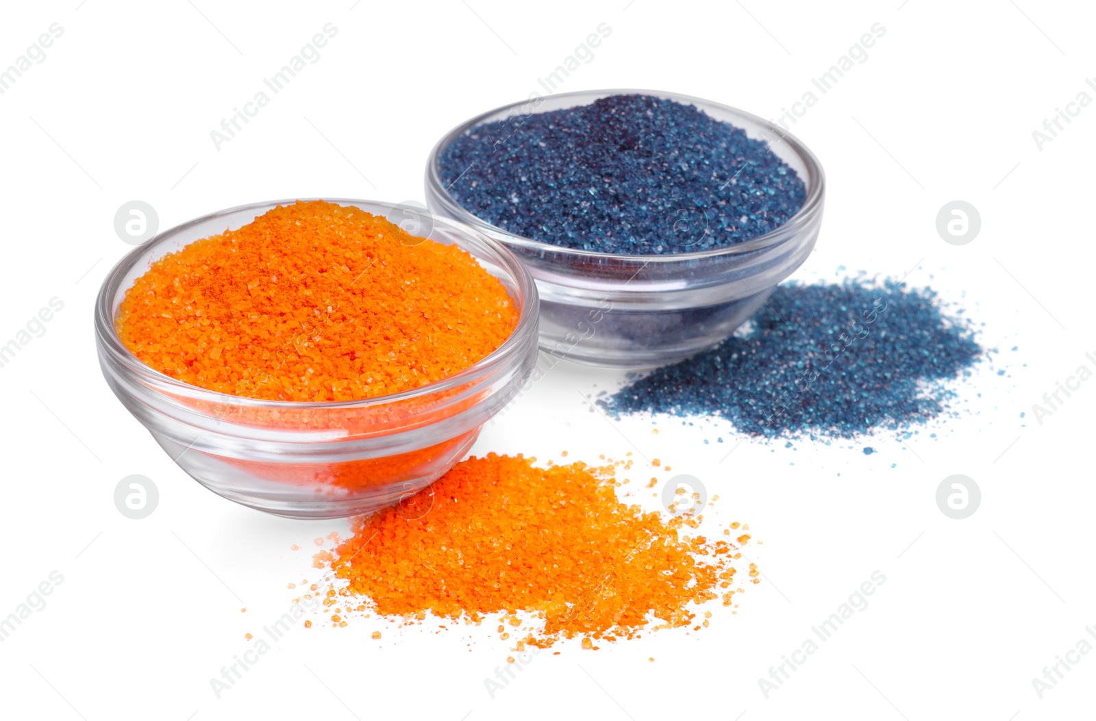 Photo of Glass bowls with orange and blue food coloring isolated on white