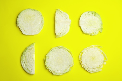 Photo of Flat lay composition with cut cabbage on color background