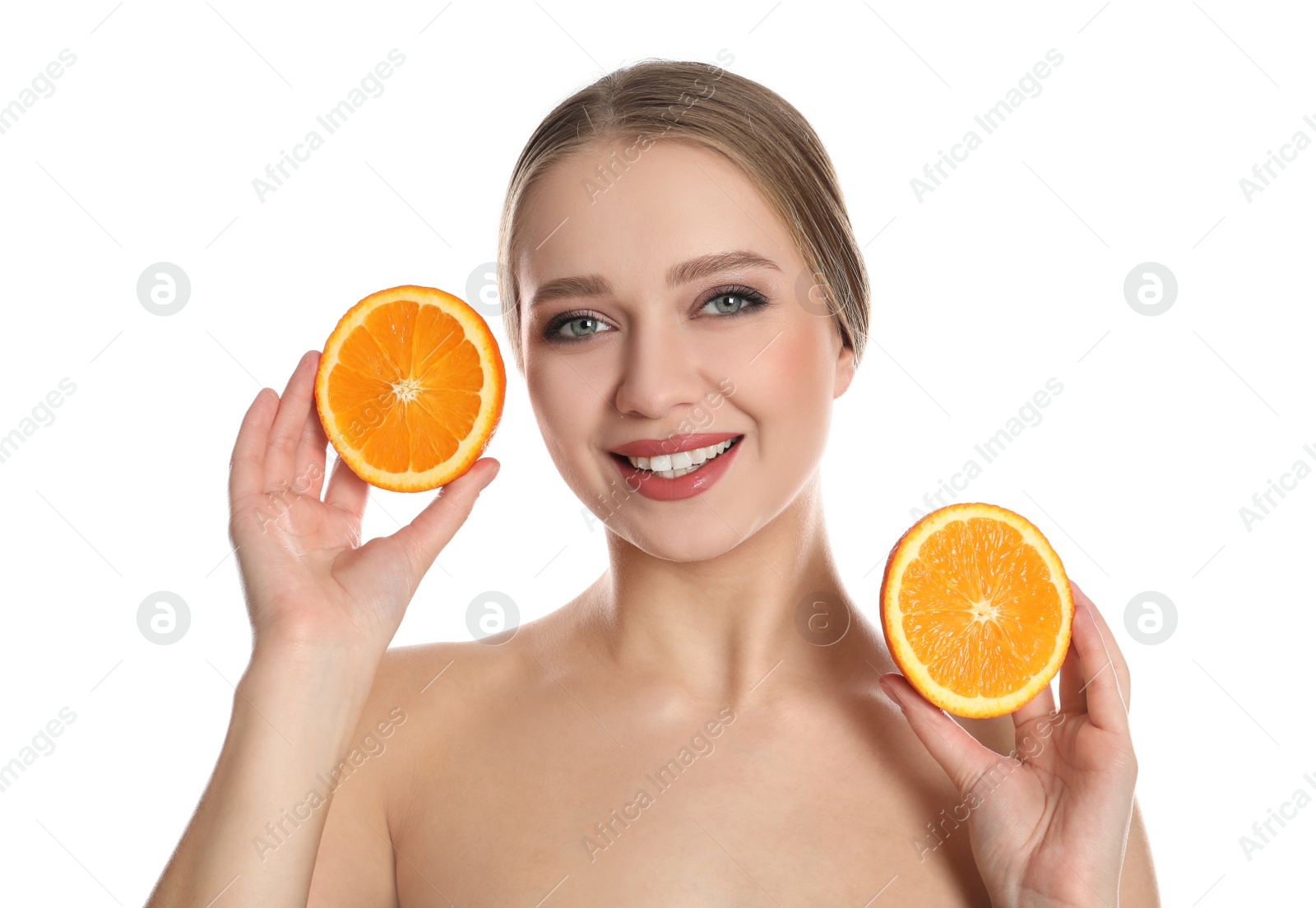 Photo of Young woman with cut orange on white background. Vitamin rich food