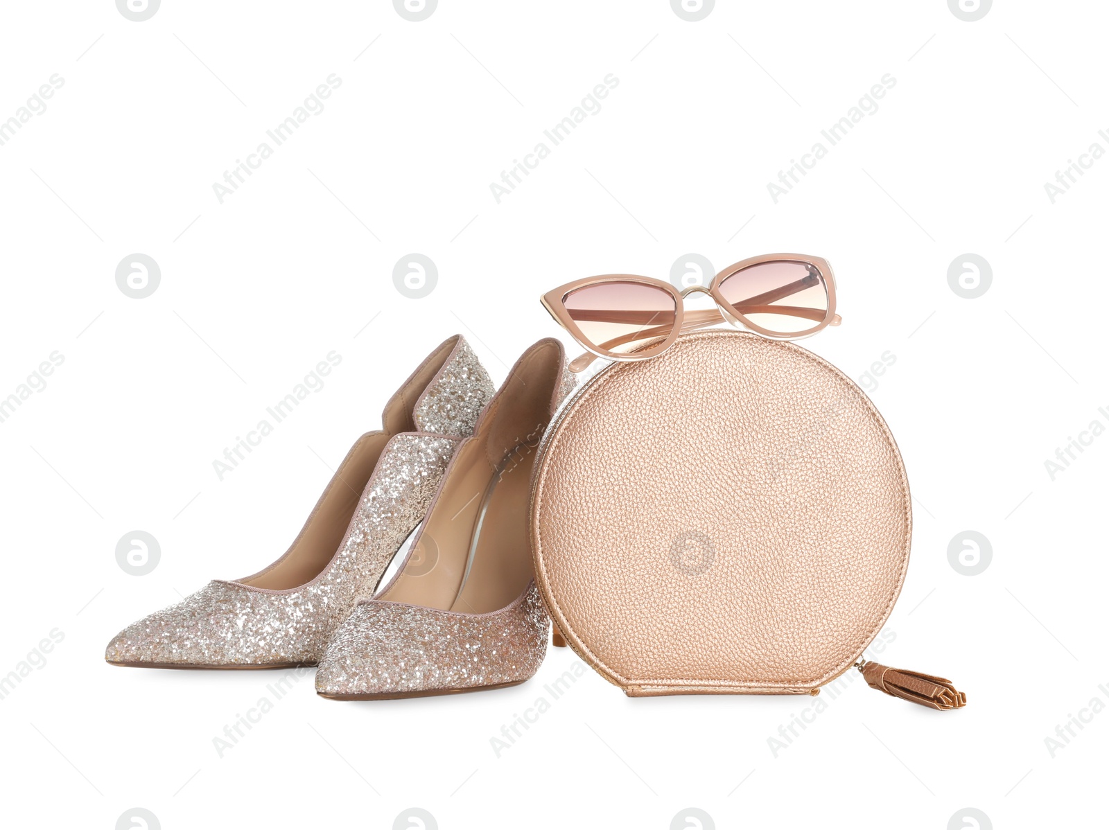 Photo of Stylish woman's bag, shoes and sunglasses isolated on white