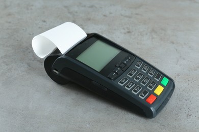 New modern payment terminal on grey table