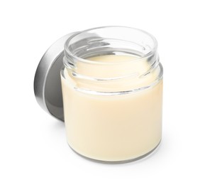Open jar with condensed milk isolated on white