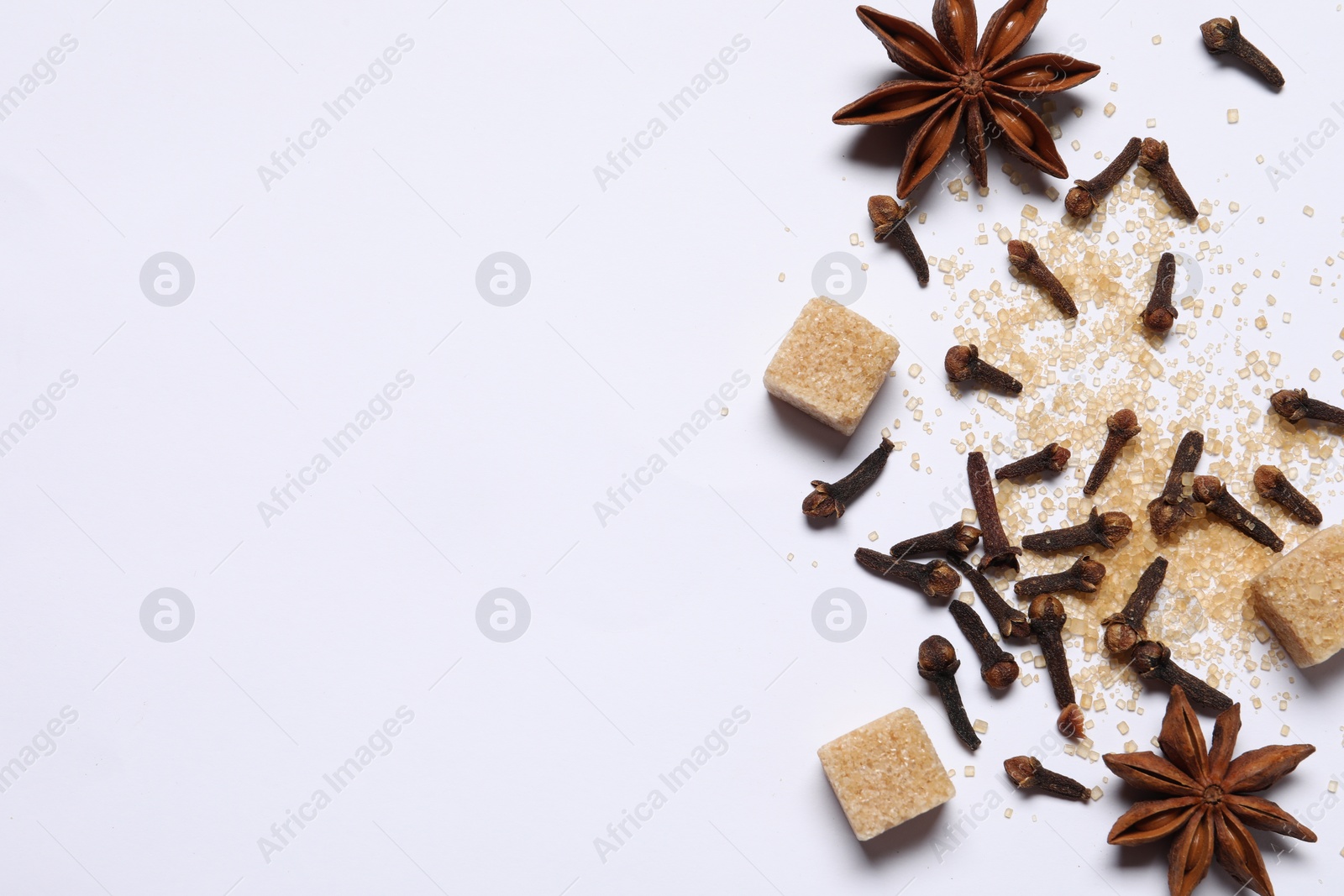 Photo of Different spices on white table, flat lay. Space for text