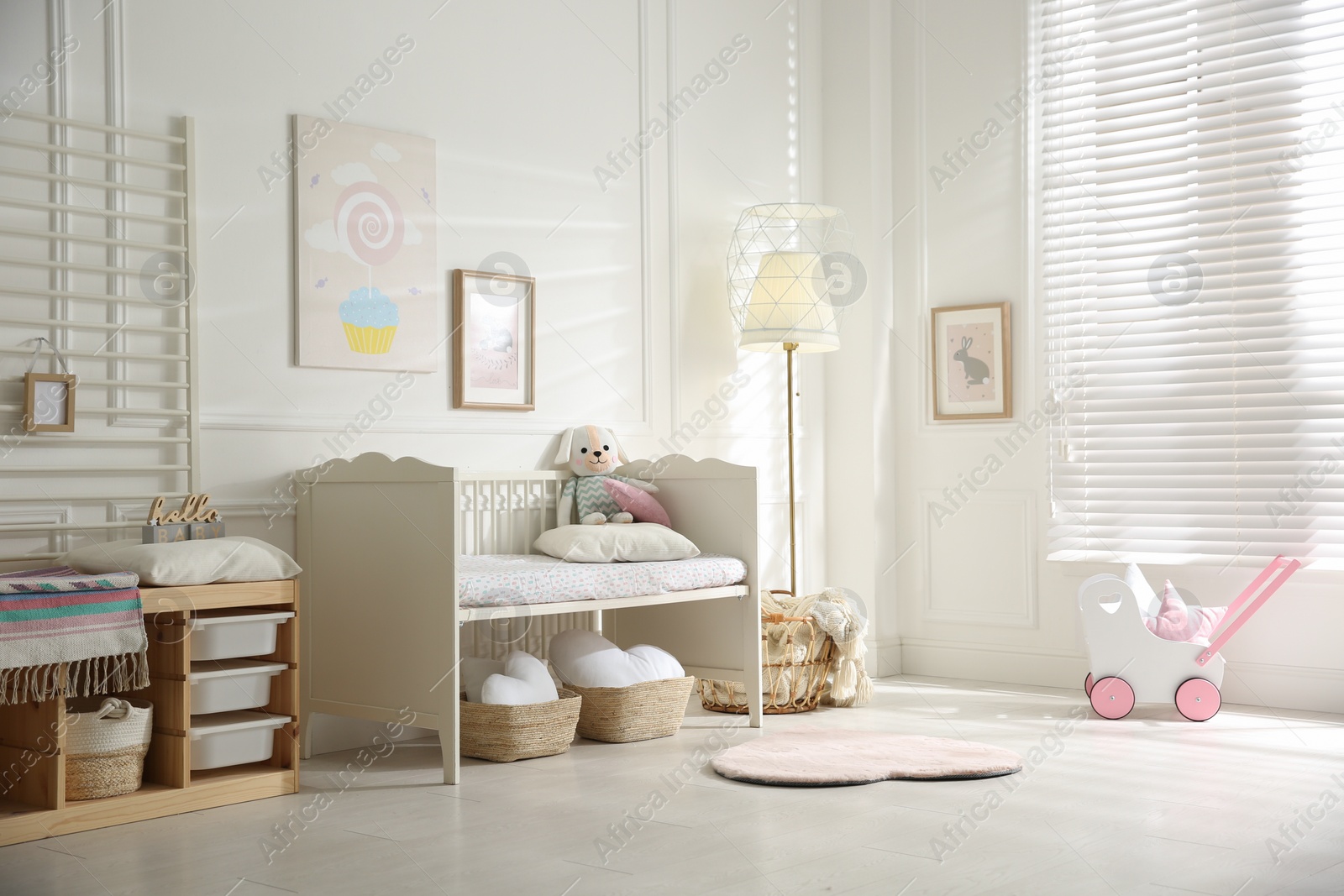 Photo of Baby room interior with stylish furniture and toys