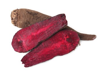 Whole and cut red beets on white background, top view