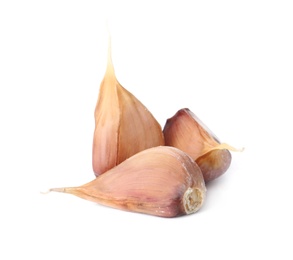 Photo of Fresh organic garlic cloves on white background