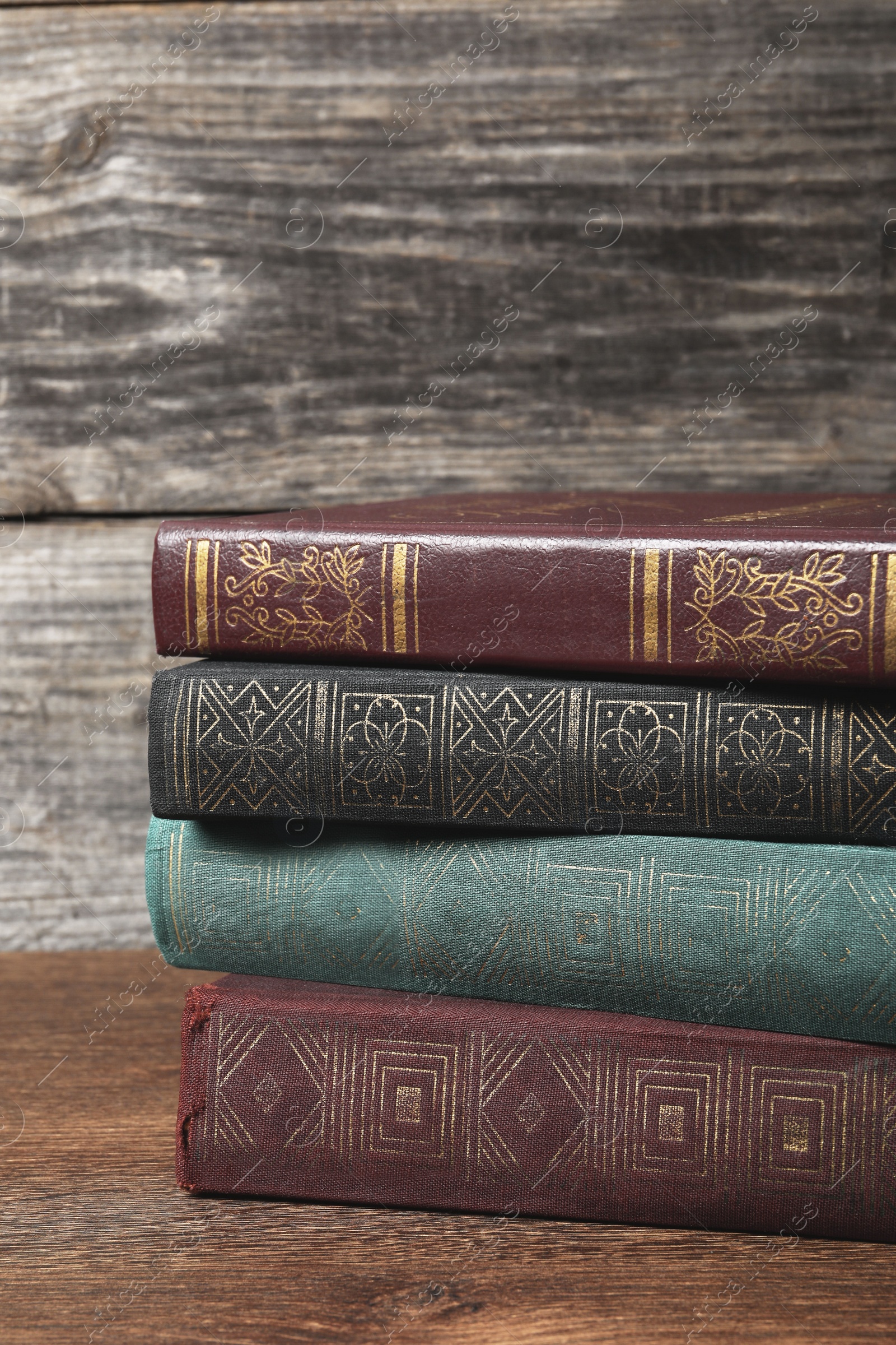 Photo of Stack of old hardcover books on wooden table