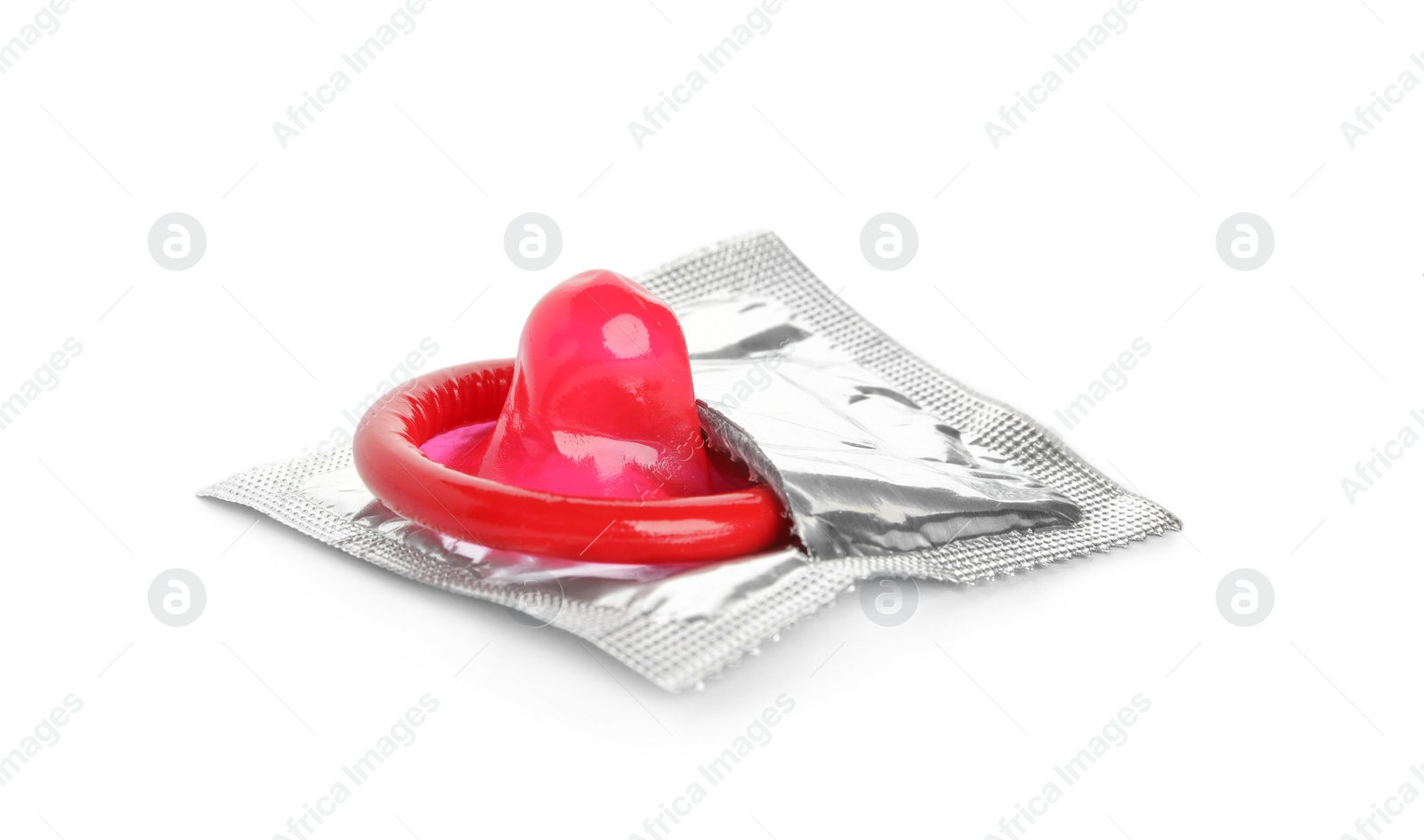 Photo of Unpacked red condom isolated on white. Safe sex