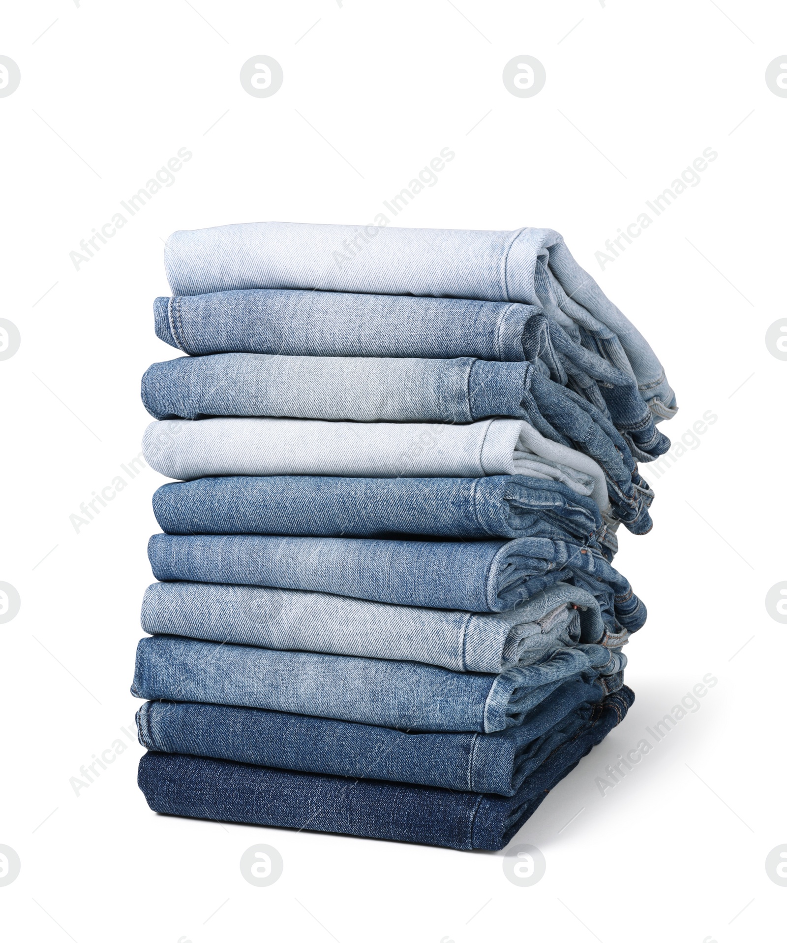 Image of Stack of different folded jeans isolated on white