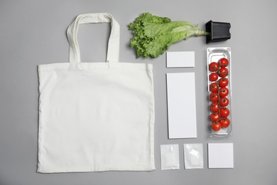 Photo of Flat lay composition with items for mock up design on gray background. Food delivery service