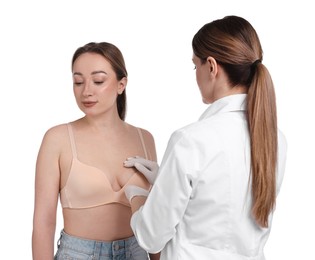 Photo of Mammologist checking woman's breast on white background