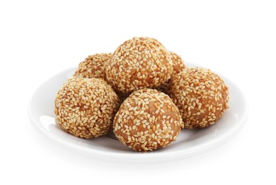 Plate of delicious sesame balls on white background