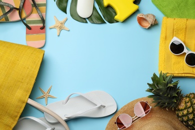 Photo of Flat lay composition with beach accessories on color background. Space for text