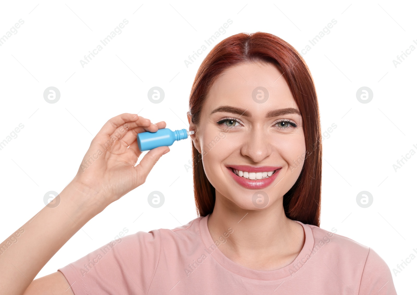 Photo of Woman using ear drops on white background