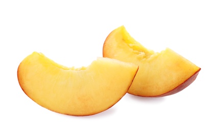 Photo of Slices of sweet juicy peach on white background