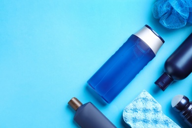 Photo of Flat lay composition with men's cosmetic products on light blue background. Space for text