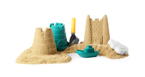 Photo of Pile of sand with beautiful castles and plastic toys isolated on white