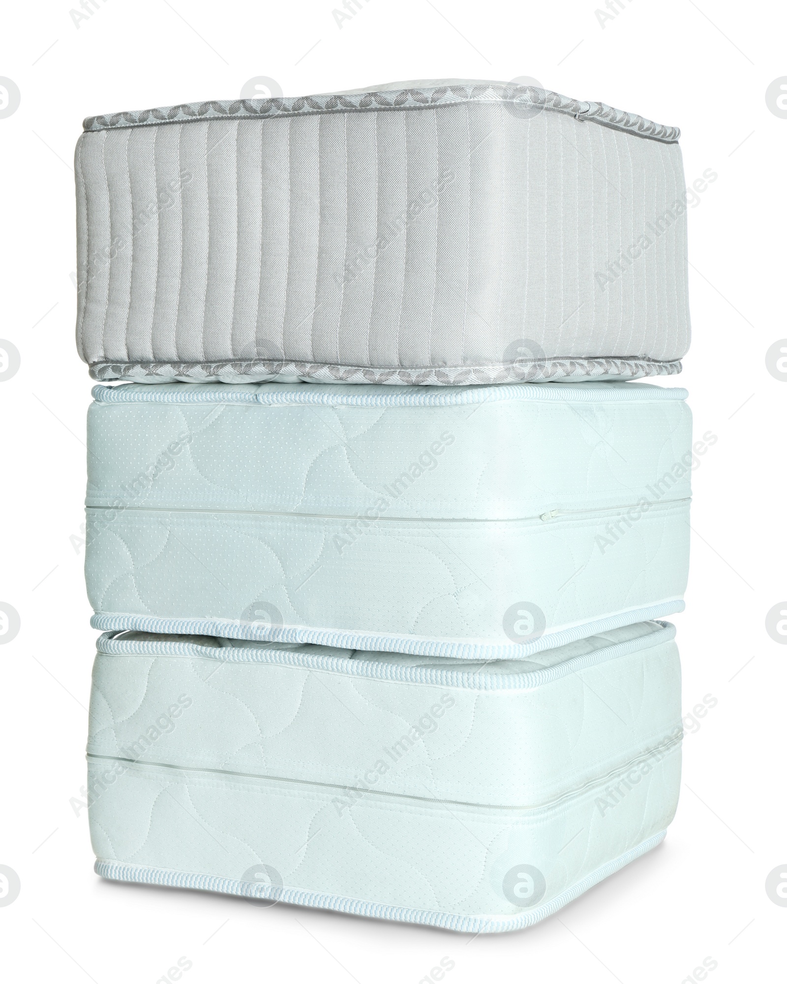 Photo of Samples of modern orthopedic mattress on white background