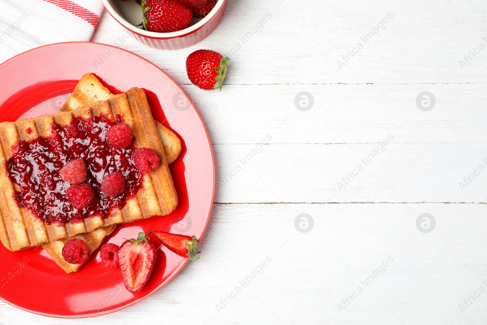 Photo of Tasty breakfast served on white wooden table, flat lay. Space for text